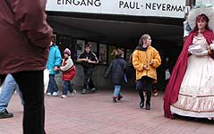 woman in fancy dress, and street kids