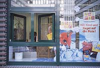 Travel agency window, with small window opened to street