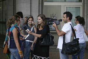 Television interview under the arcades of Piazza de Ferrari