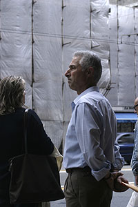 Man holding envelop in Via XX Settembre, Genoa