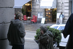 Men under the arcades near Piazza de Ferrari / Via XXV Aprile