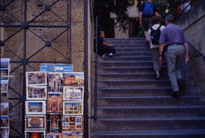 Woman selling pictures on stairs leading to the Chiesa  S. M. dell' Ammiraglio (o Martorana), Palermo