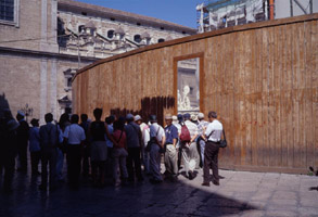 Japanese tourists cluster at the fontana Pretoria (off Via Maqueda), Palermo