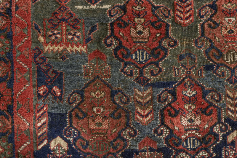Dated Afshar rug with camel cartouche, Kerman area, south Persia around 1900: close-up