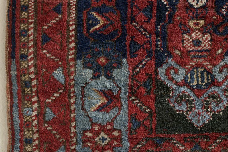 Dated Afshar rug with camel cartouche, Kerman area, south Persia around 1900: lower left