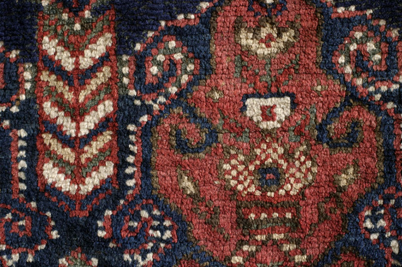 Dated Afshar rug with camel cartouche, Kerman area, south Persia around 1900: close-up of pile