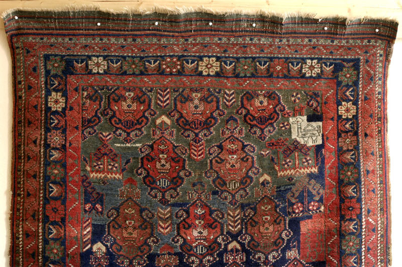 Dated Afshar rug with camel cartouche, Kerman area, south Persia around 1900: top half