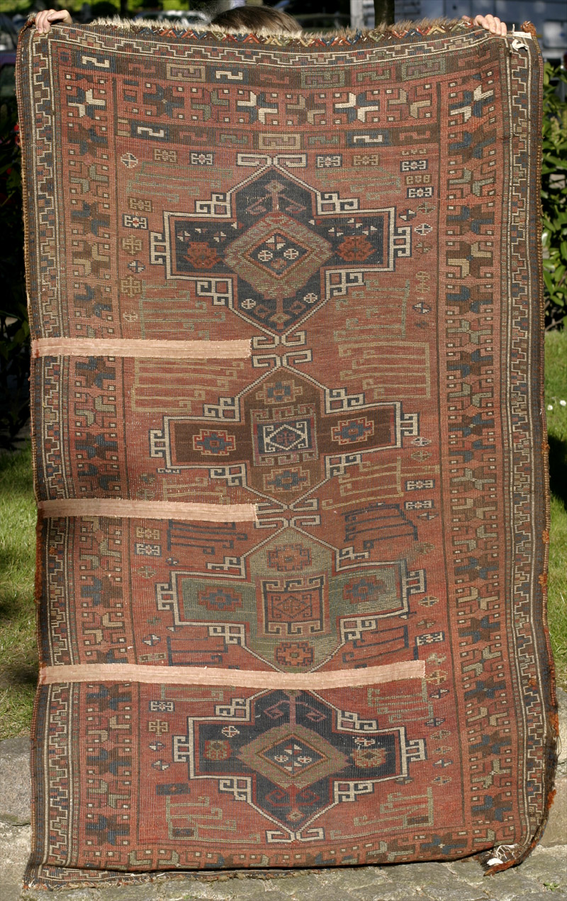 Anatolian village rug - back side wth cut and shut areas