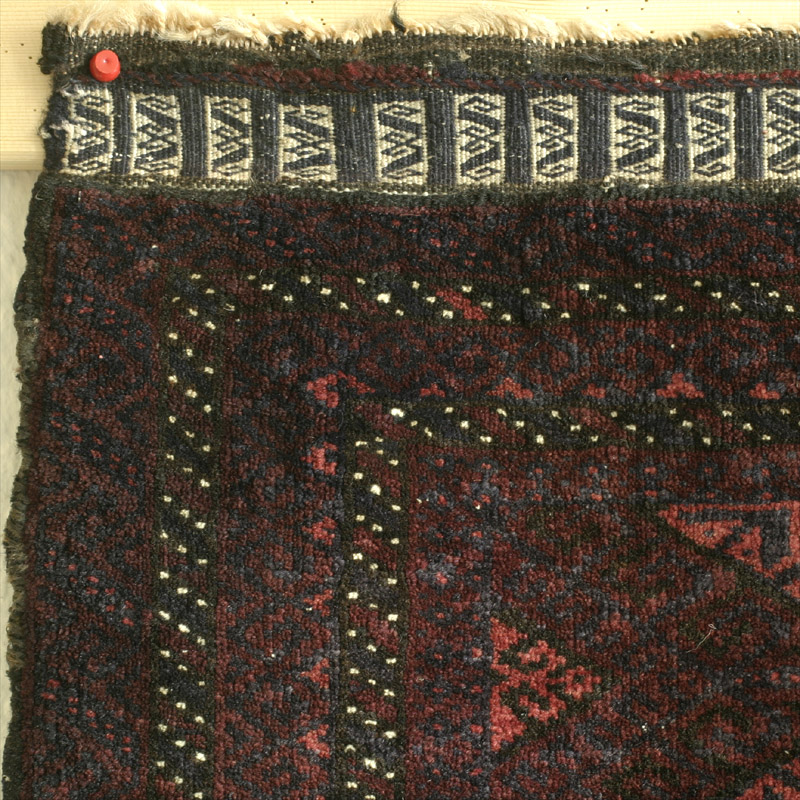 Khorassan Baluch balisht face - top left corner with end adorned by weft-float brocading