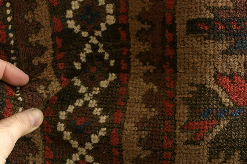 Baluch tree of life rug, pile fold