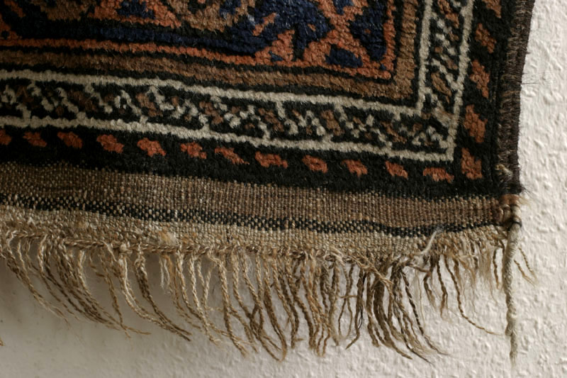 Small antique Khorassan Baluch rug with endless repeat diamond and flower design, lower righ tcorner