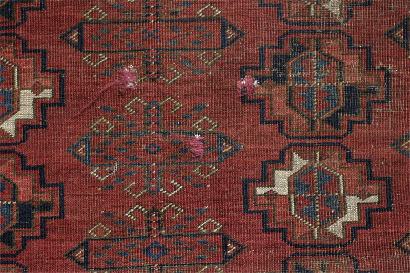 Ersari Turkmen chuval, south Turkmenistan or Afghanistan, third quarter 19th century: three small hole swith darning