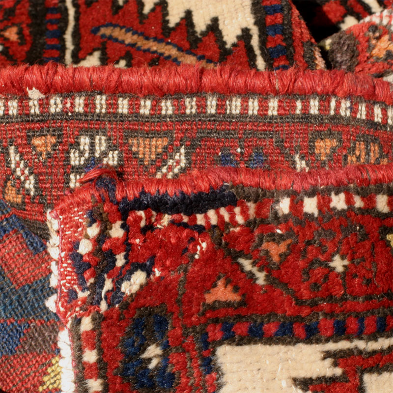 Kurdish hexagon lattice rug - restored corner closeup