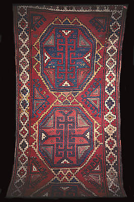 Image 3: Divan rug. Detail with typical star-octogons and hooks.