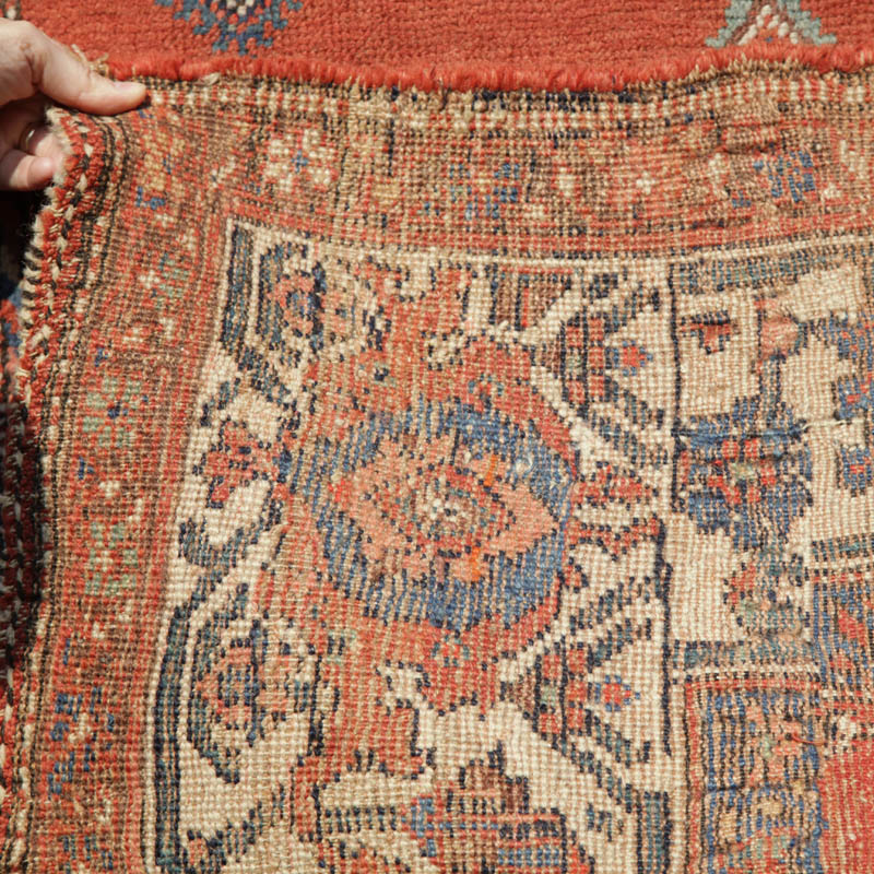 Kurdish medallion rug with humans and animals - back