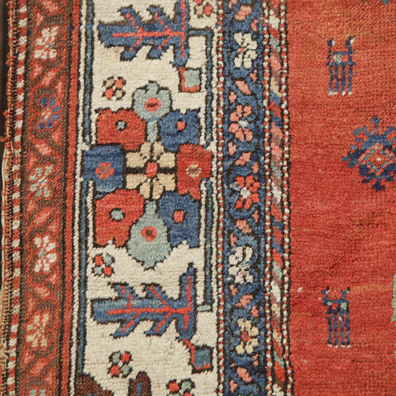 Kurdish medallion rug with humans and animals - border