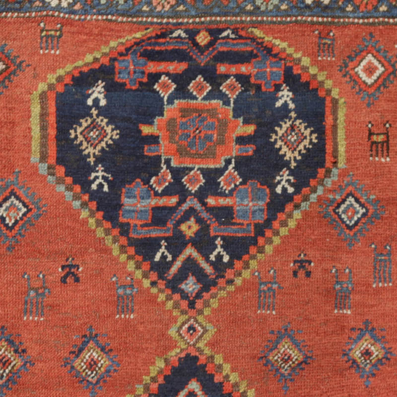 Kurdish medallion rug with humans and animals - upper medallion