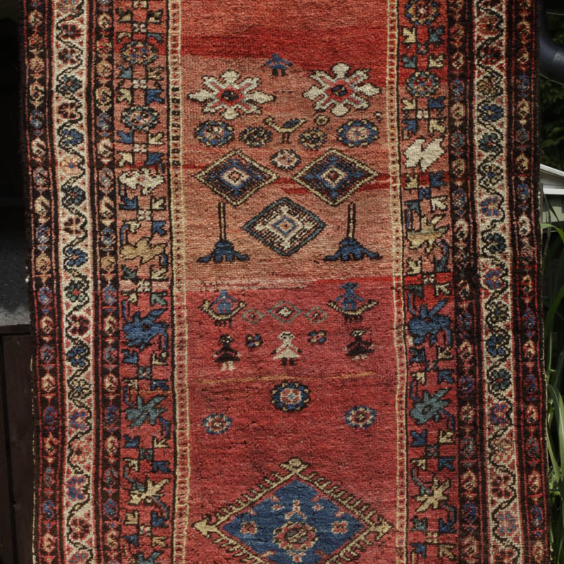 Kurdish rug with humans and animals - upper central area