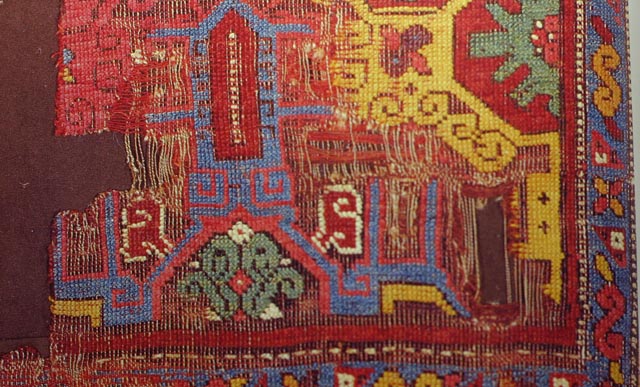 Intense colour in the Yellow and blue carpet with griffin and archaic border