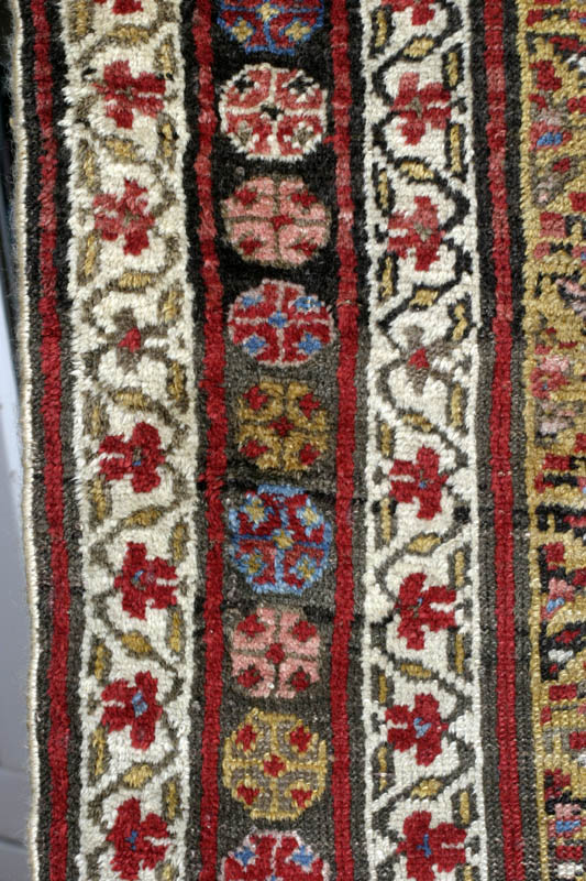 Antique Kurdish rug, end of 19th c., shrubs on yellow ground: border design