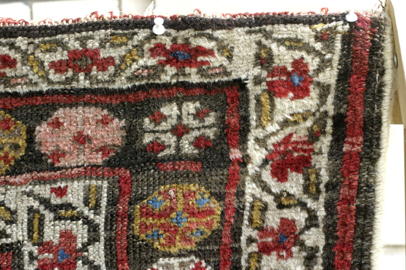 Antique Kurdish rug, end of 19th c., shrubs on yellow ground: top right corner