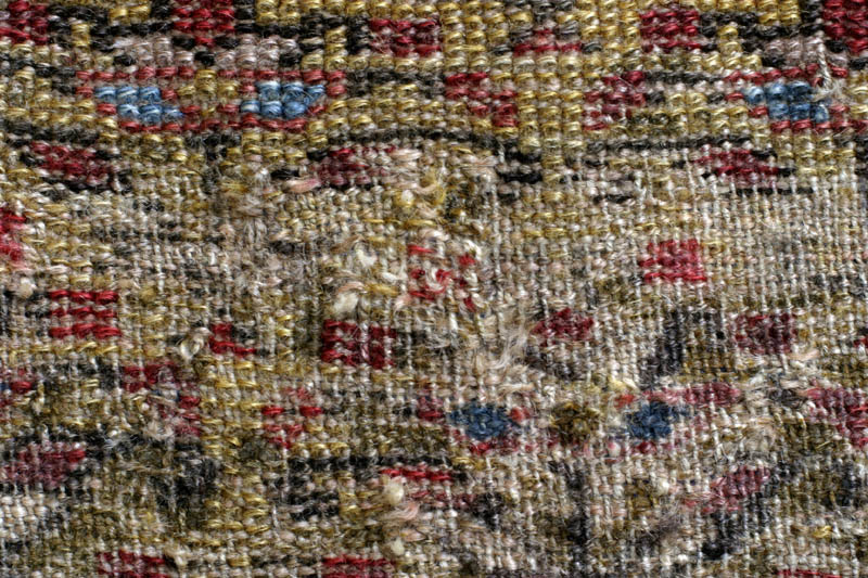 Antique Kurdish rug, end of 19th c., shrubs on yellow ground: worst wear