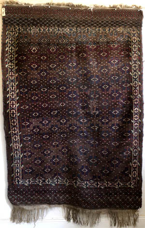 full view of antique Yomud Turkmen rug with simplified dyrnak gul