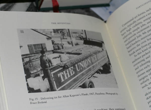 Photo of book showing a photo of a truck delivering ice for Allan Kaprov's Fluids
