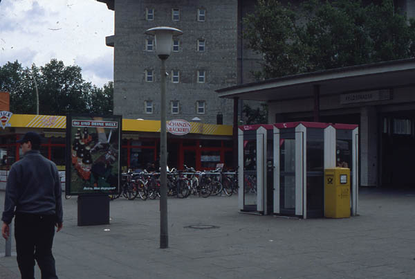 Surroundings with advert on back of info-box at U-Bahn Station Feldstrasse
